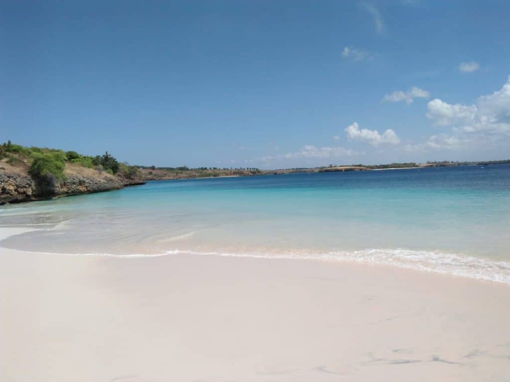 Turquoise sea meeting pink sands